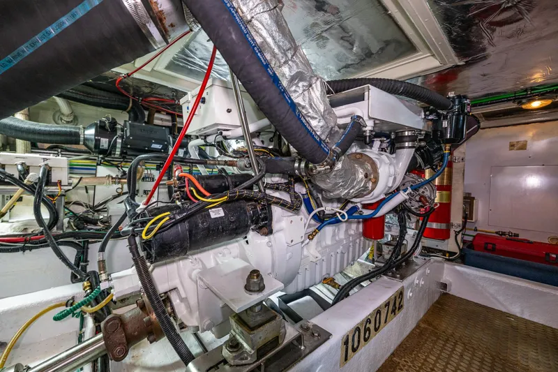 Moore Fun Yacht Photos Pics Engine room of 1998 Ocean Alexander 486 Classico Pilothouse with complex wiring and machinery.