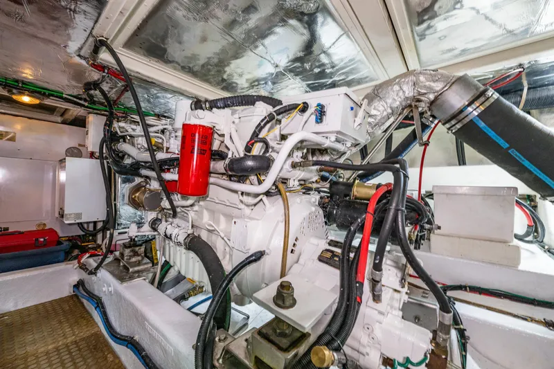 Moore Fun Yacht Photos Pics Engine room of 1998 Ocean Alexander 486 Classico Pilothouse with complex machinery and wiring.