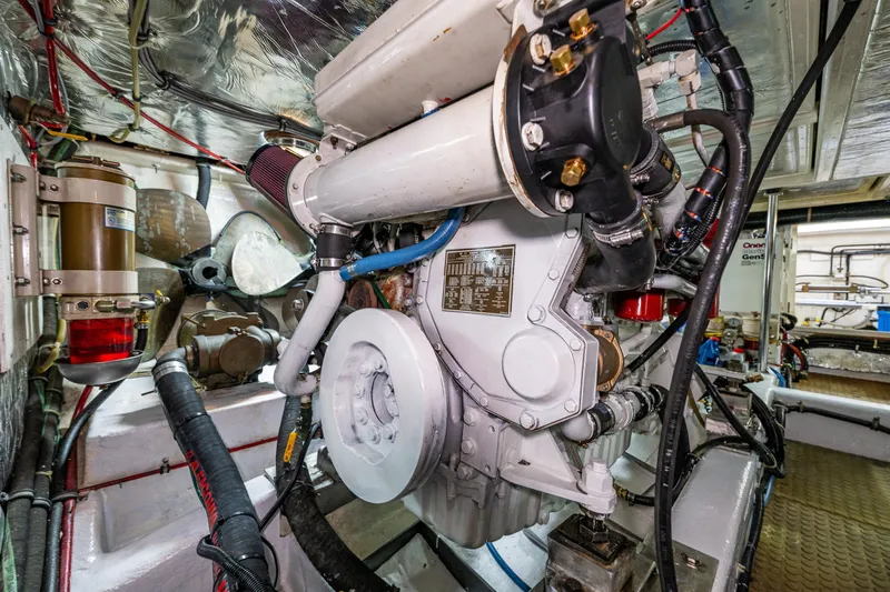 Moore Fun Yacht Photos Pics Engine room of 1998 Ocean Alexander 486 Classico Pilothouse yacht, showcasing machinery and components.