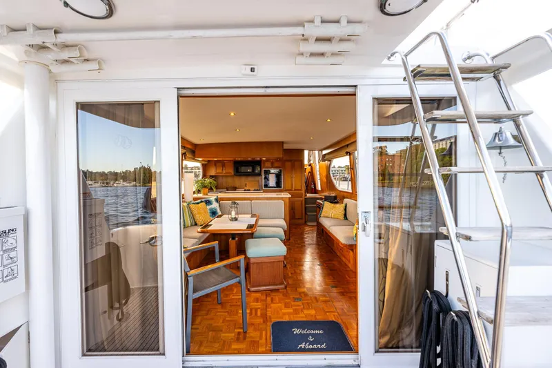 Moore Fun Yacht Photos Pics Luxurious interior of 1998 Ocean Alexander 486 Classico Pilothouse yacht with elegant seating and decor.