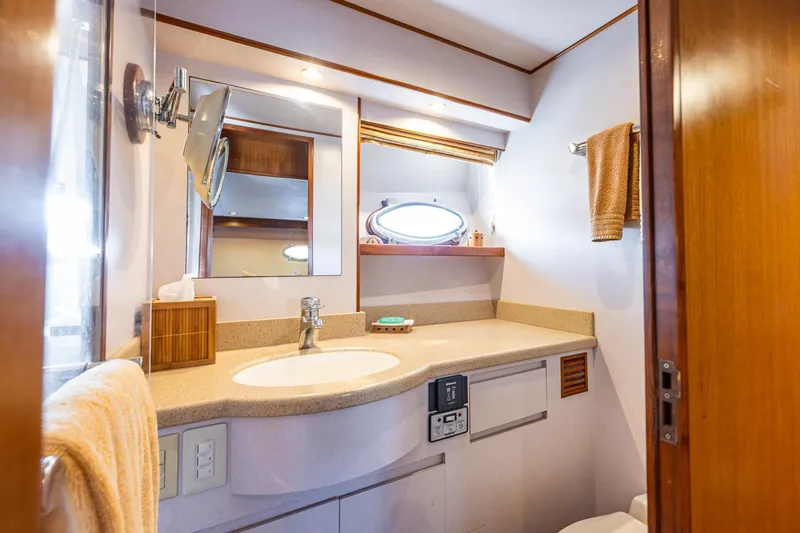 Moore Fun Yacht Photos Pics Luxurious bathroom in 1998 Ocean Alexander 486 Classico Pilothouse yacht, featuring elegant fixtures.