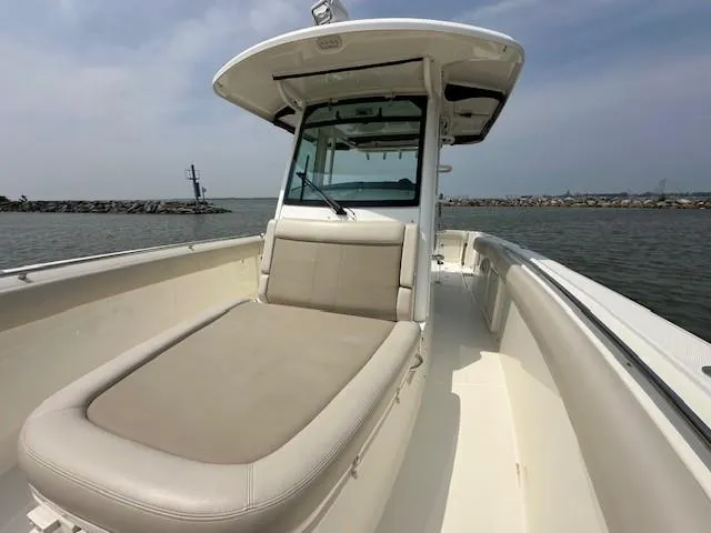 Boston Whaler 330 Outrage Yacht Photos Pics 2016 Boston Whaler 330 Outrage boat on water, featuring spacious deck and seating.