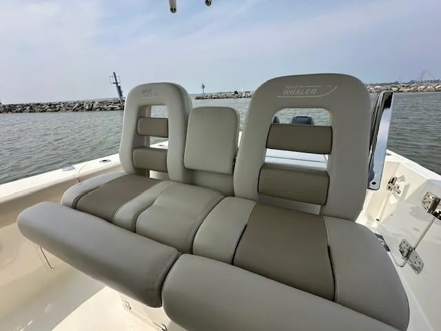 Boston Whaler 330 Outrage Yacht Photos Pics Boston Whaler 330 Outrage 2016 boat seats with ocean view in the background.