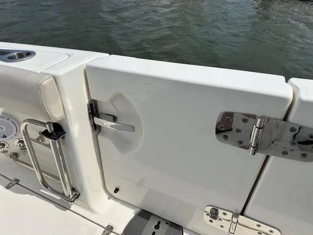 Boston Whaler 330 Outrage Yacht Photos Pics 2016 Boston Whaler 330 Outrage boat door with stainless steel hinges and handle.