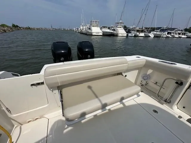 Boston Whaler 330 Outrage Yacht Photos Pics 2016 Boston Whaler 330 Outrage boat with dual engines, docked in a marina.