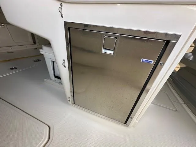 Boston Whaler 330 Outrage Yacht Photos Pics Stainless steel compartment on 2016 Boston Whaler 330 Outrage boat interior.