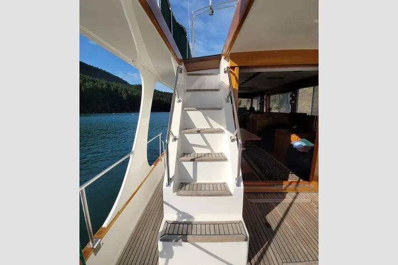 Goodlife Yacht Photos Pics Staircase on 1998 Grand Banks 46 Europa yacht, leading to upper deck with scenic water view.