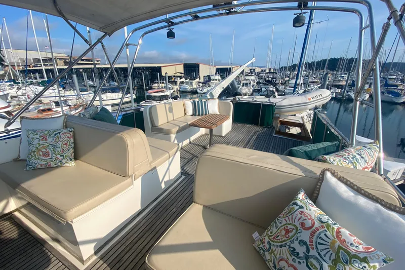 Goodlife Yacht Photos Pics Spacious deck of 1998 Grand Banks 46 Europa yacht with comfortable seating and marina view.