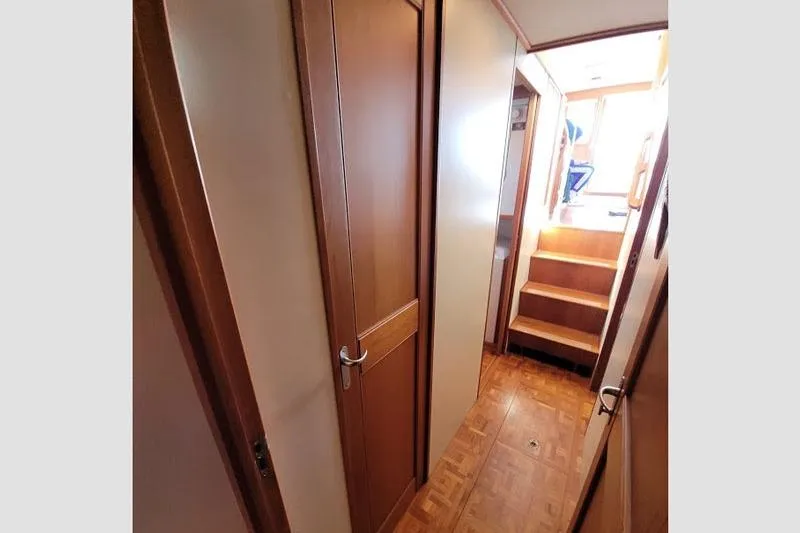 Goodlife Yacht Photos Pics Hallway inside 1998 Grand Banks 46 Europa yacht with wooden doors and stairs.