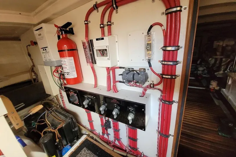 Goodlife Yacht Photos Pics Electrical panel and fire extinguisher in 1998 Grand Banks 46 Europa yacht engine room.