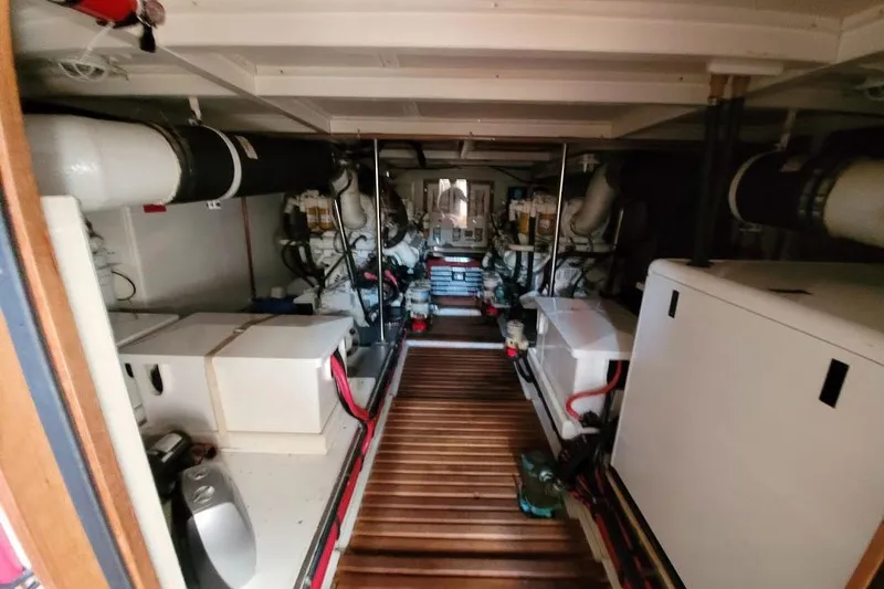 Goodlife Yacht Photos Pics Engine room of 1998 Grand Banks 46 Europa yacht, featuring mechanical equipment and piping.