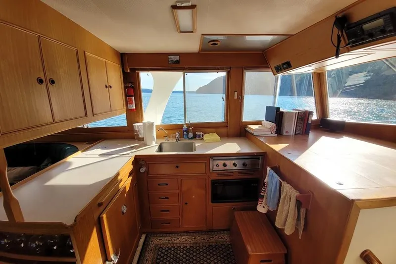 Goodlife Yacht Photos Pics Interior of 1998 Grand Banks 46 Europa yacht kitchen with ocean view.