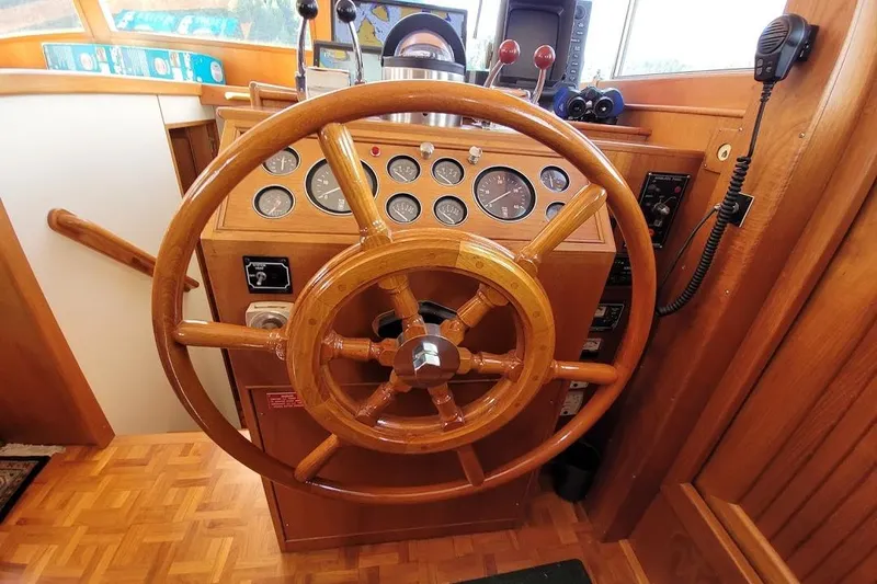 Goodlife Yacht Photos Pics Wooden helm of 1998 Grand Banks 46 Europa yacht with gauges and controls.