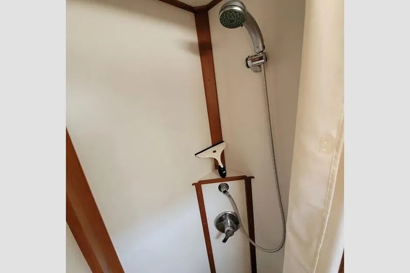 Goodlife Yacht Photos Pics Shower area in 1998 Grand Banks 46 Europa yacht with handheld showerhead.