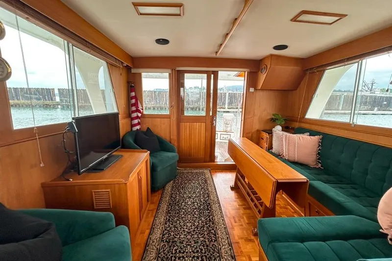 Goodlife Yacht Photos Pics Interior of 1998 Grand Banks 46 Europa yacht with cozy seating and elegant wood finish.
