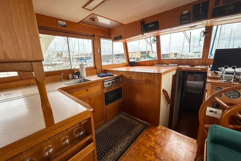 Goodlife Yacht Photos Pics Interior of 1998 Grand Banks 46 Europa yacht with wooden cabinetry and nautical decor.