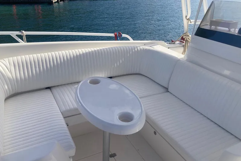 Runaway Bunny Yacht Photos Pics Luxurious seating area on a 2006 Intrepid 370 Cuddy boat with ocean view.