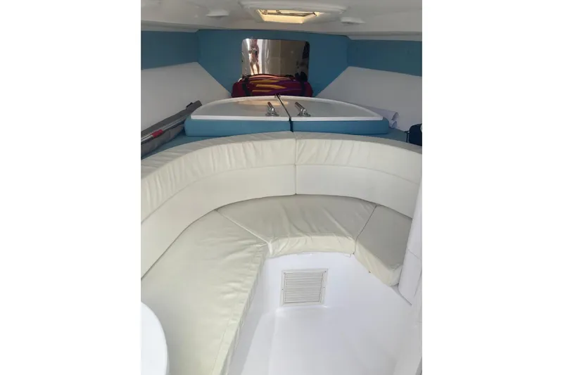 Runaway Bunny Yacht Photos Pics 2006 Intrepid 370 Cuddy cabin interior with white seating and compact layout.