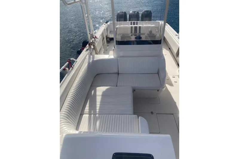 Runaway Bunny Yacht Photos Pics 2006 Intrepid 370 Cuddy boat interior with white seating and ocean backdrop.