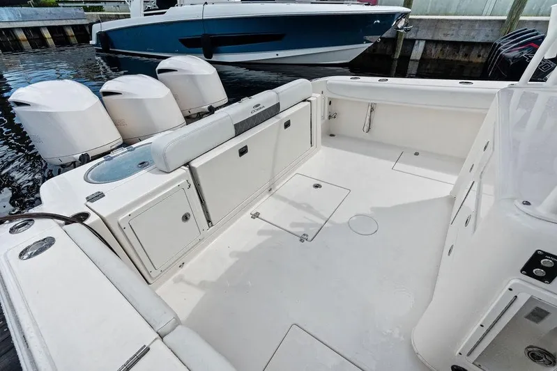  Yacht Photos Pics 2021 Cobia 350 Center Console boat interior with triple outboard engines.