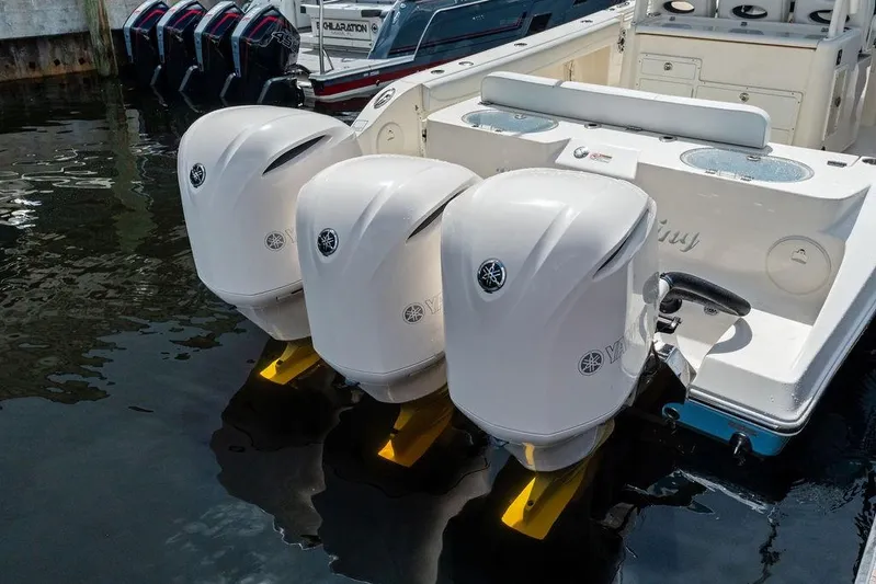  Yacht Photos Pics 2021 Cobia 350 Center Console with triple Yamaha outboard engines docked.