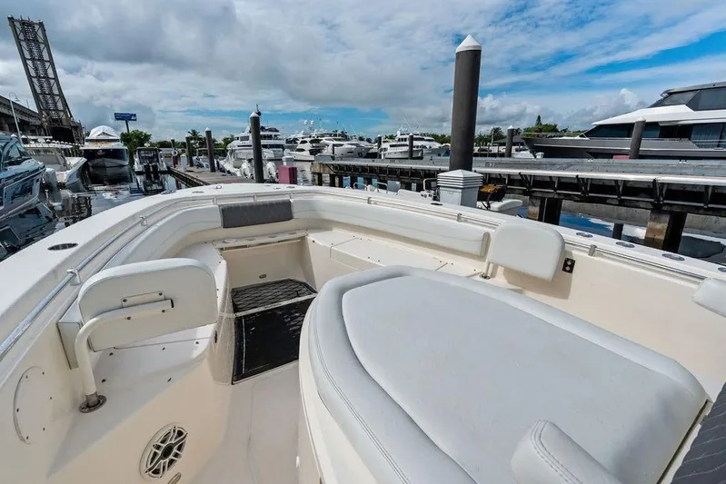  Yacht Photos Pics 2021 Cobia 350 Center Console boat docked at marina under blue sky.