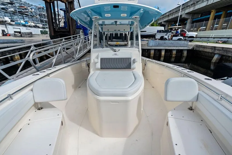  Yacht Photos Pics 2021 Cobia 350 Center Console boat docked, showcasing spacious seating and sleek design.