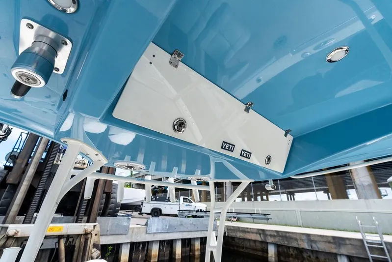  Yacht Photos Pics 2021 Cobia 350 Center Console boat interior with Yeti storage, blue and white design.