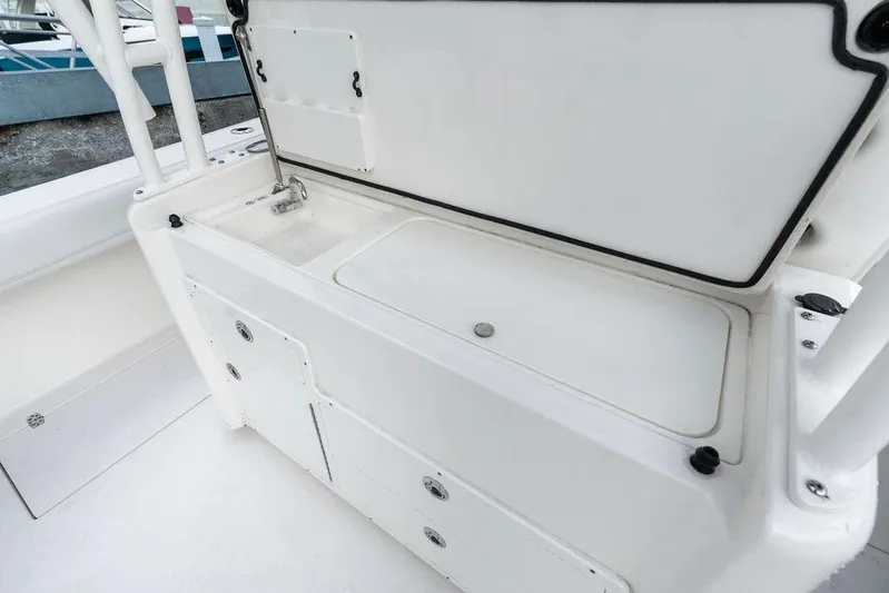  Yacht Photos Pics 2021 Cobia 350 Center Console boat interior with storage compartments and sink.