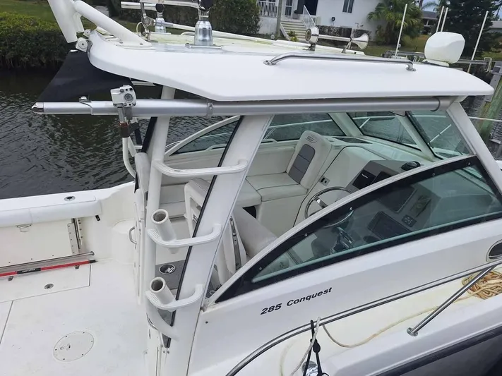  Yacht Photos Pics 2013 Boston Whaler 285 Conquest boat, featuring a sleek design and spacious cockpit.