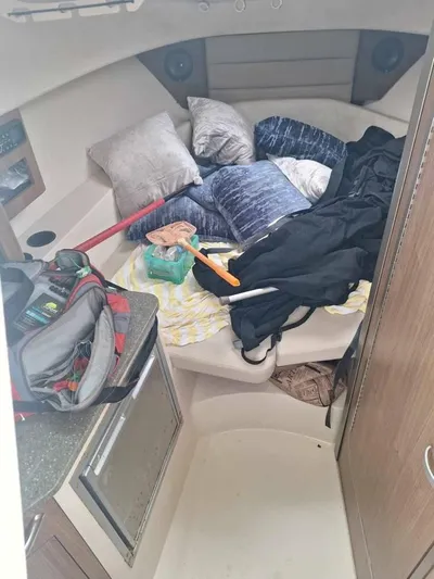  Yacht Photos Pics Interior cabin of 2013 Boston Whaler 285 Conquest with cushions and gear.