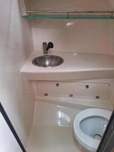  Yacht Photos Pics 2013 Boston Whaler 285 Conquest bathroom with sink and toilet.