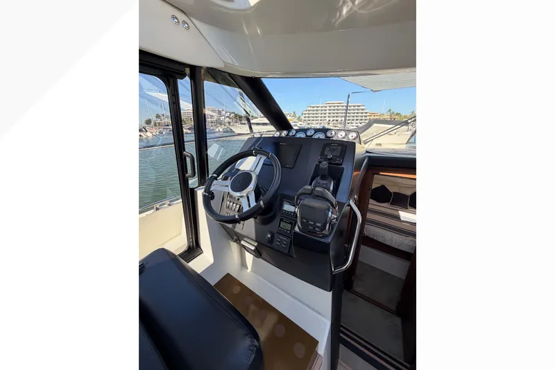Requin Yacht Photos Pics 2019 Jeanneau NC 11 helm with steering wheel and control panel, docked at marina&nbsp;&nbsp;for sale in Mexico by Servicios Nauticos and Gaston Troche