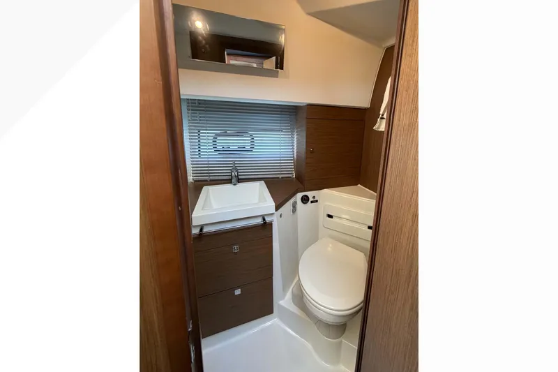 Requin Yacht Photos Pics 2019 Jeanneau NC 11 bathroom with modern sink, toilet, and wooden cabinetry&nbsp;&nbsp;for sale in Mexico by Servicios Nauticos and Gaston Troche
