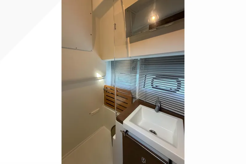 Requin Yacht Photos Pics 2019 Jeanneau NC 11 bathroom interior with sink, blinds, and modern fixtures&nbsp;&nbsp;for sale in Mexico by Servicios Nauticos and Gaston Troche
