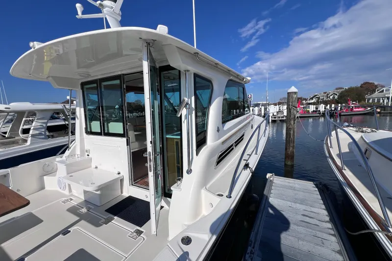 Wally World Yacht Photos Pics 2024 Back Cove 39O yacht docked at marina, showcasing sleek design and spacious deck.