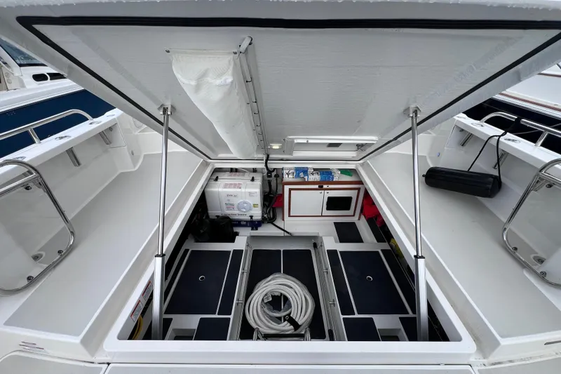 Wally World Yacht Photos Pics 2024 Back Cove 39O boat storage compartment with equipment and organized interior layout.