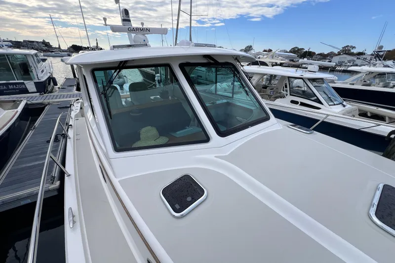 Wally World Yacht Photos Pics 2024 Back Cove 39O boat docked, featuring sleek design and Garmin equipment.