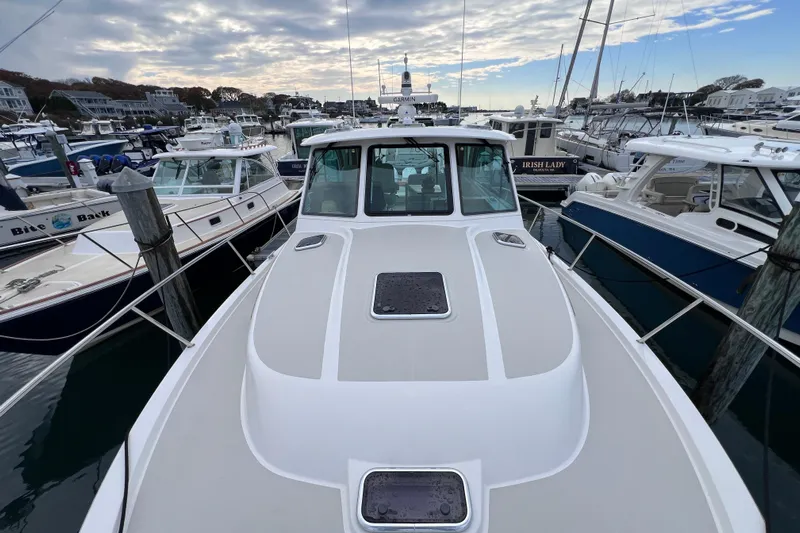 Wally World Yacht Photos Pics 2024 Back Cove 39O yacht docked at a marina, surrounded by other boats.