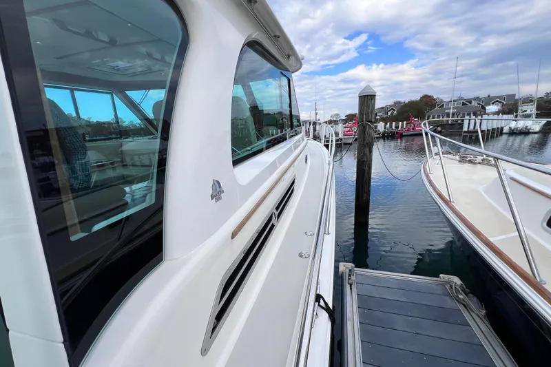 Wally World Yacht Photos Pics 2024 Back Cove 39O yacht docked at marina, showcasing sleek design and spacious deck.