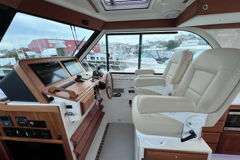 Wally World Yacht Photos Pics 2024 Back Cove 39O helm with dual seats and advanced navigation system.