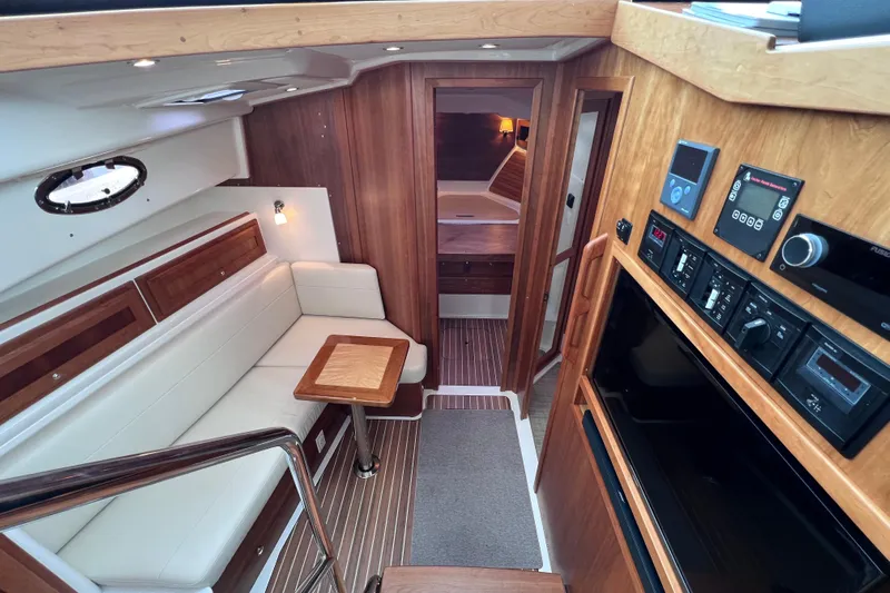 Wally World Yacht Photos Pics Luxurious 2024 Back Cove 39O yacht interior with wood accents and modern amenities.