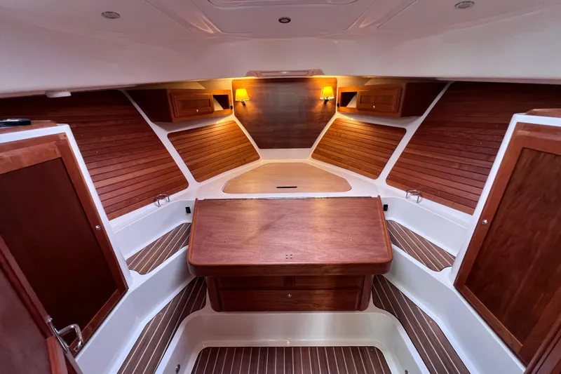 Wally World Yacht Photos Pics Luxurious 2024 Back Cove 39O yacht interior with elegant wood finishes and ambient lighting.
