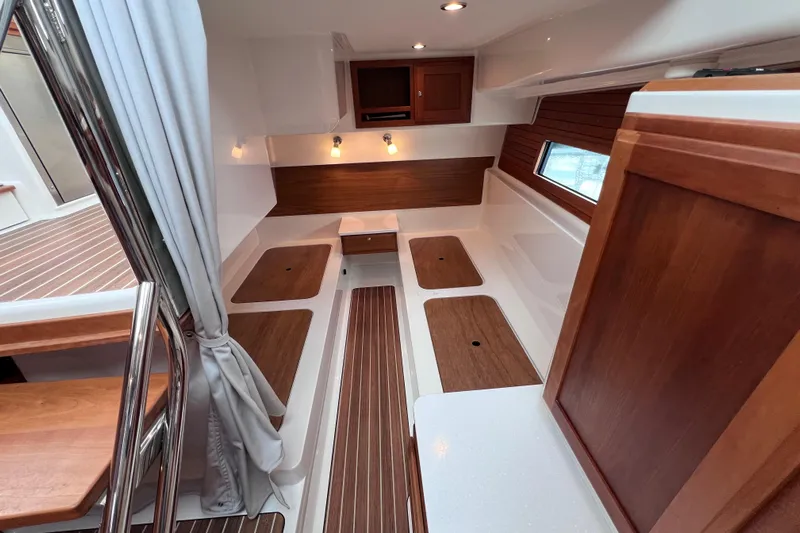 Wally World Yacht Photos Pics 2024 Back Cove 39O interior with wood accents and modern lighting.