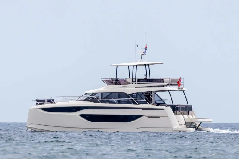  Yacht Photos Pics 2024 Prestige M48 yacht cruising on open water, showcasing sleek design and luxury features.