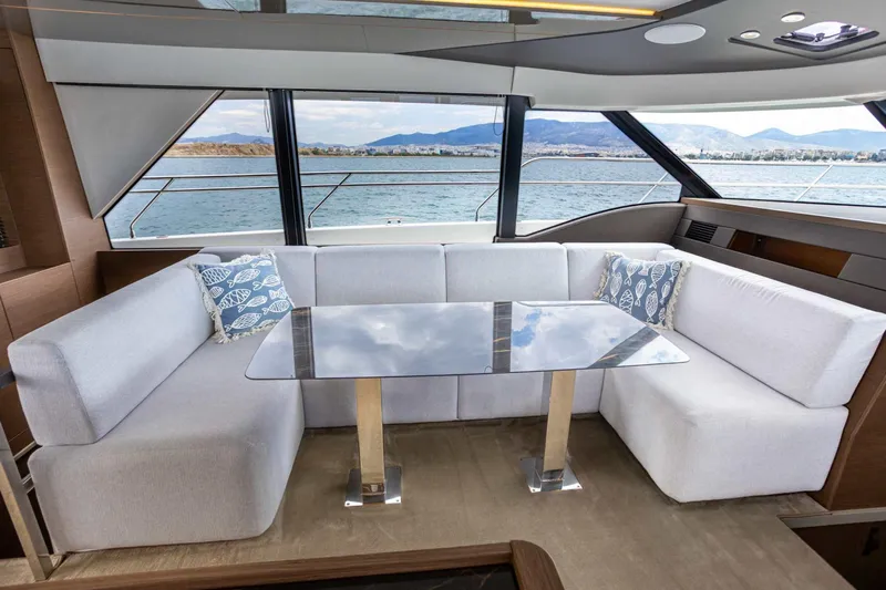  Yacht Photos Pics Luxurious interior of 2024 Prestige M48 yacht with elegant seating and ocean view.