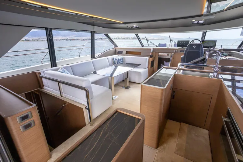  Yacht Photos Pics Luxurious interior of 2024 Prestige M48 yacht with modern seating and panoramic windows.