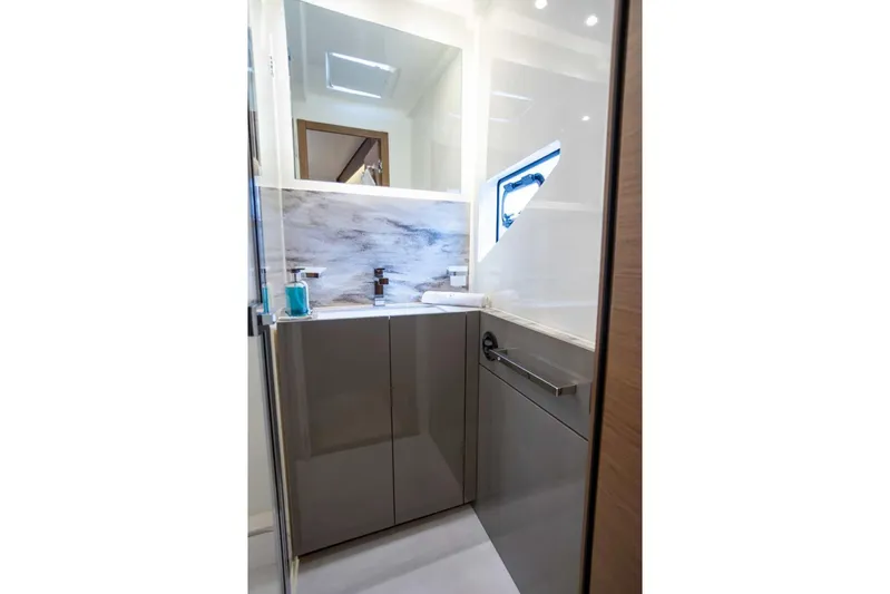  Yacht Photos Pics Modern bathroom interior on 2024 Prestige M48 yacht, featuring sleek cabinetry and elegant fixtures.