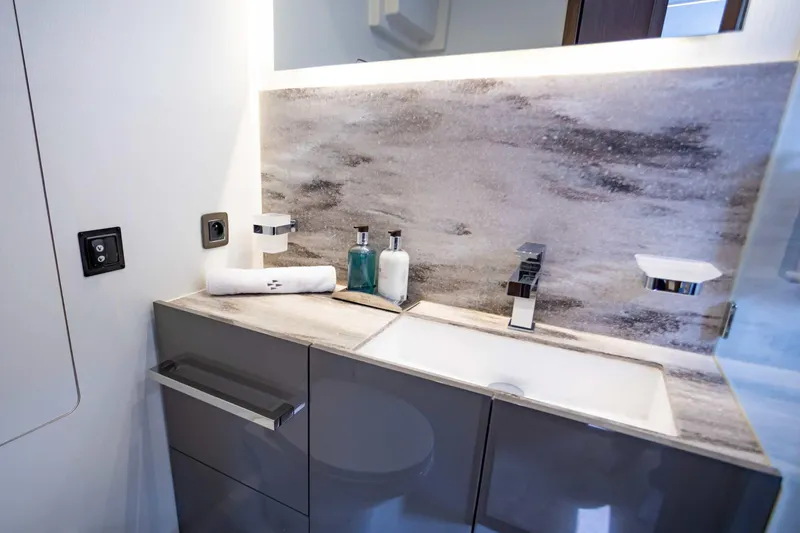  Yacht Photos Pics Luxurious bathroom sink in 2024 Prestige M48 yacht, featuring modern fixtures and elegant design.