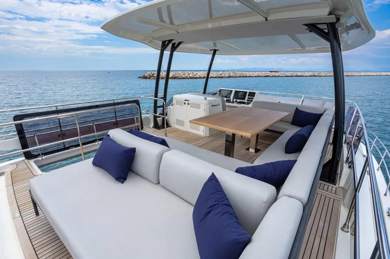  Yacht Photos Pics Luxurious 2024 Prestige M48 yacht deck with elegant seating and ocean view.